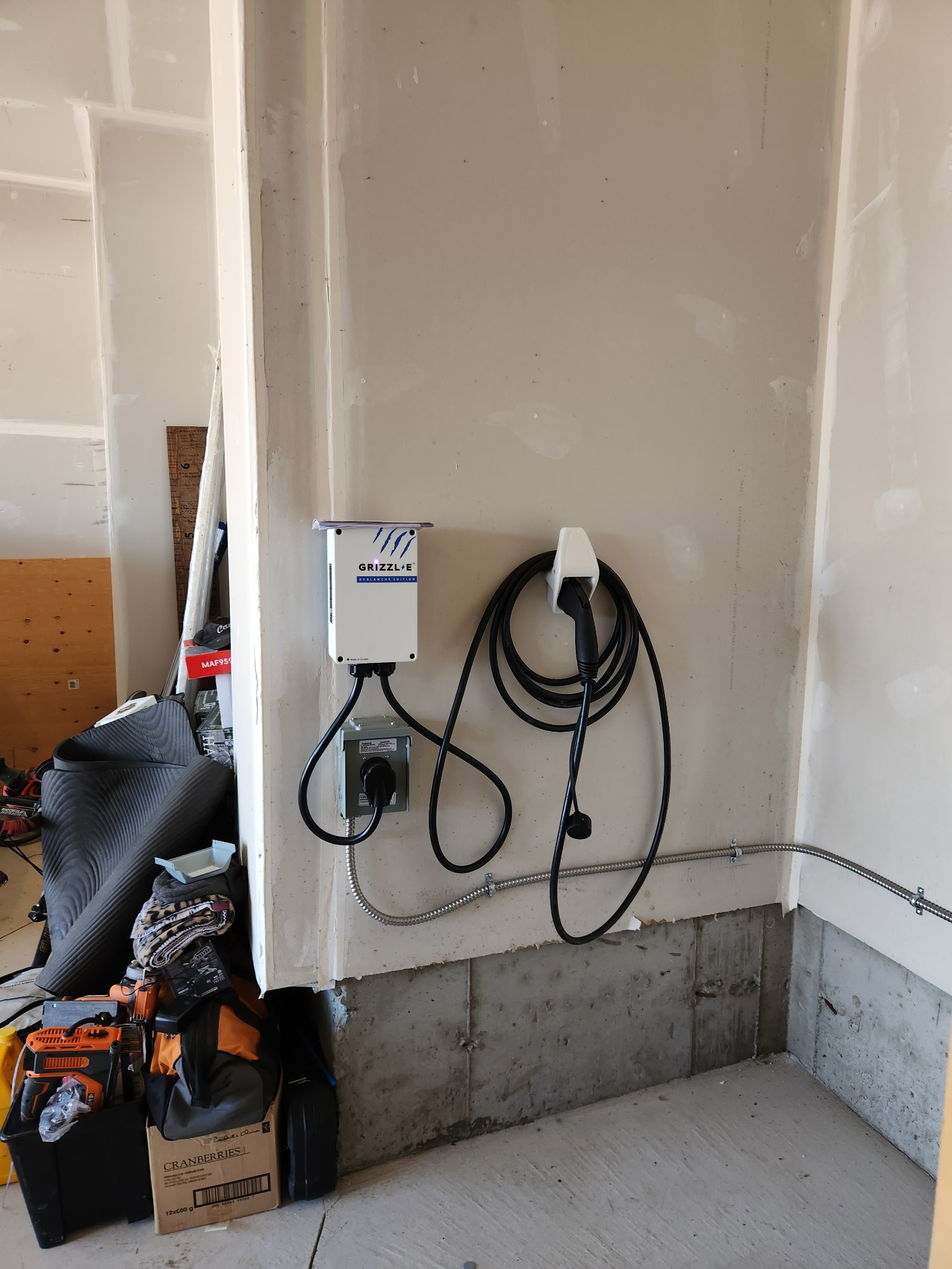 Wall-mounted EV charger installed in a garage